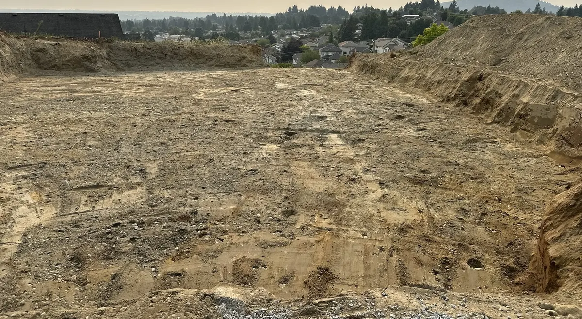 Excavated building lot graded for a new home build