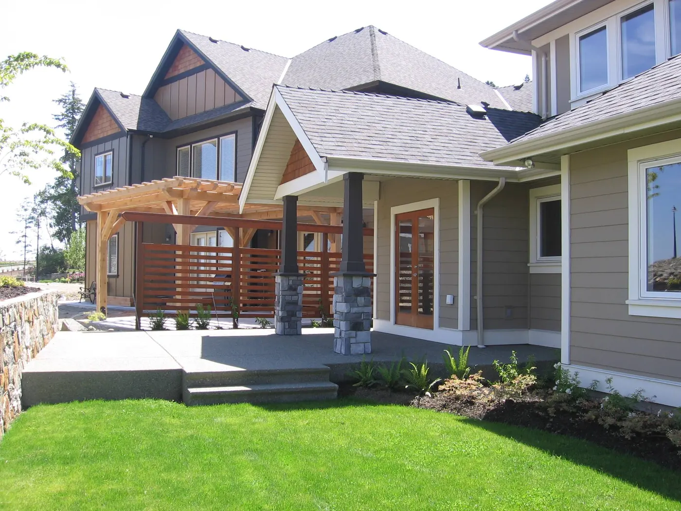 Stone entry stairs and front door of a craftsman custom home